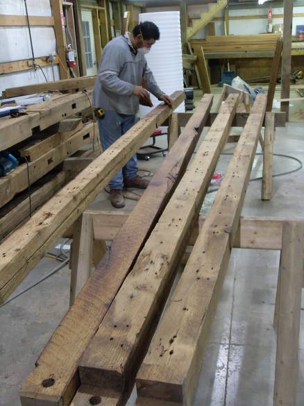 Camp Barn Restoration / Cannon Salvage workers cleaning, applying borate, and waxing the frame.